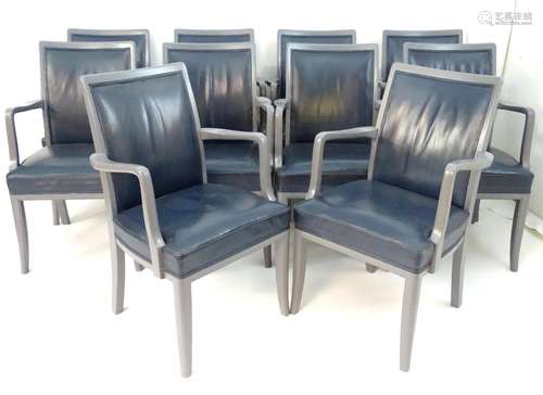 A set of ten 20thC carvers / open armchairs with leather upholstered backrests and seats, having