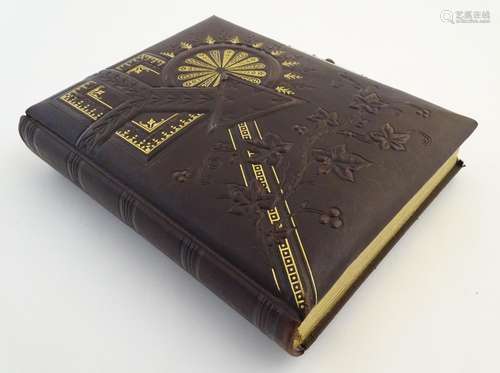 A Victorian leather and gilt photograph album, containing portraits (some from Cornish studios, J.