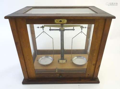 A set of vintage laboratory balance scales by W&J George (Birmingham) and FE Becker & Co (London),