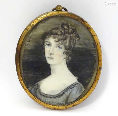 A 19thC oval watercolour portrait miniature depicting a woman. Approx. 3 1/2