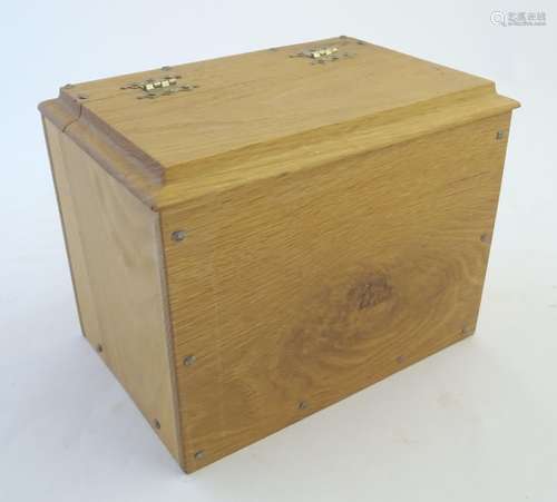 A late-20thC oak candle box, with hinged step chamfered top, 10