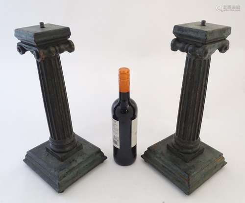 A pair of hardwood lamp bases/supports formed as Ionic columns, with green patinated finish, each