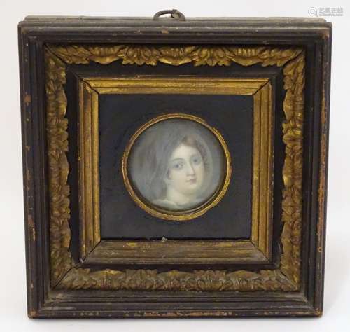 A 19thC English School circular watercolour and bodycolour portrait miniature depicting the head