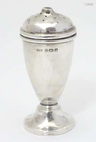 A silver pepper pot hallmarked Birmingham 1933 maker A L Davenport Ltd. 3 1/2