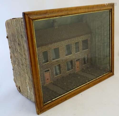 A 19thC folkart diorama, displaying a row of terraced houses, 26