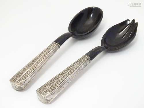 A pair of horn salad servers with Malasian white metal handles having Malay script to end. Approx