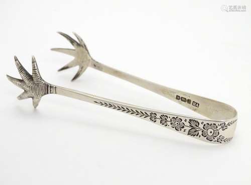 Silver bird?s claw sugar tongs with floral and foliate decoration. Hallmarked Sheffield 1911 maker