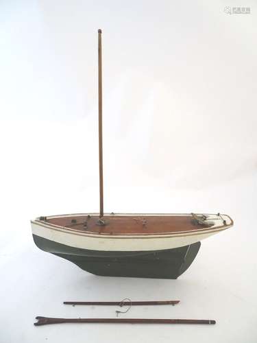 Toy: An early 20thC painted wooden toy boat / pond yacht. Approx. 22'' long Please Note - we do