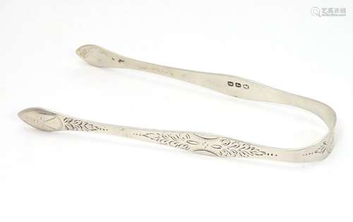 Georgian silver sugar tongs with engraved foliate decoration. Hallmarked London 1810 maker Peter and