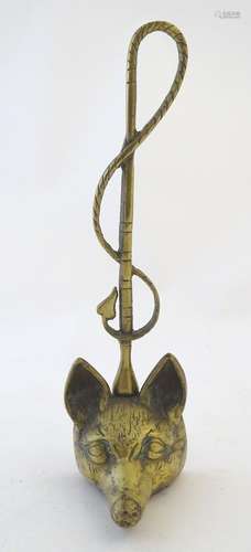 A Victorian cast brass figural doorstop/door porter, hunting themed, formed as a fox mask surmounted