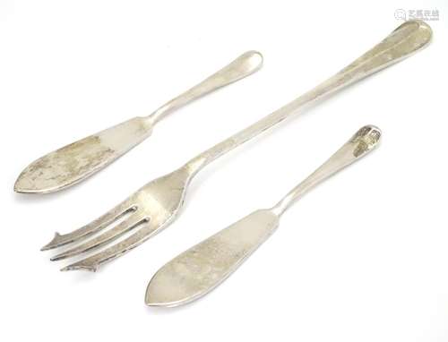 A pair of Hanoverian silver butter knives, together with a pickle fork. Hallmarked Sheffield 1965,