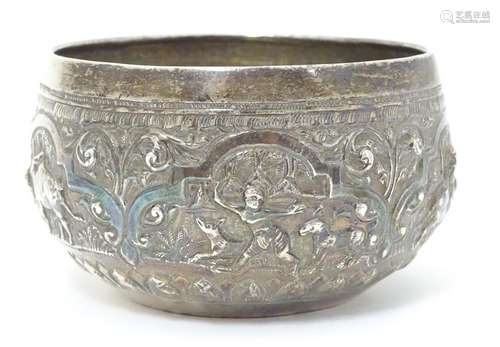 A white metal bowl with embossed figural and animal etc. decoration. Probably Indian. Approx. 3 1/2