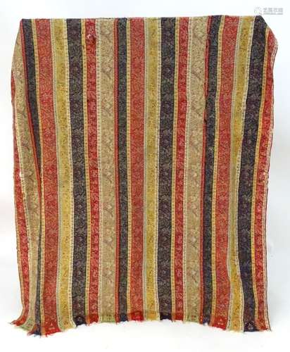 A mid 19thC woven long shawl with hand embroidered floral and foliate panels and border to each end.