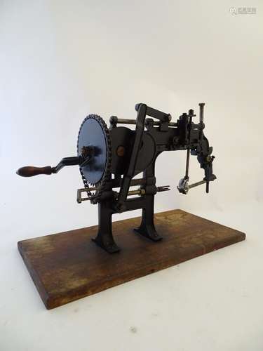 Kitchenalia: an early-20th mechanical apple coring and peeling device, chain-driven, with black