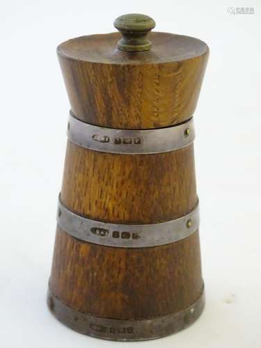 Kitchenalia: a turned oak pepper mill with three silver bands, hallmarked 1930 Birmingham maker John