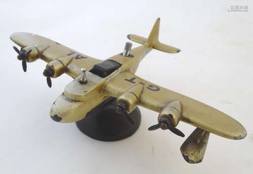 An Art Deco novelty table lighter formed as a four-engined seaplane, by Parker (Dunhill) London,