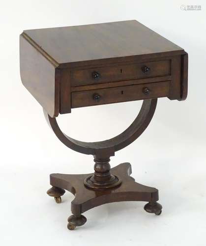 An early / mid 19thC mahogany sewing box / work box with a rectangular top flanked by drop flaps,