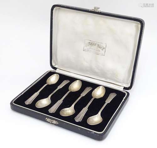 A cased set of 6 teaspoons marked silver, the case marked Duel Craft Jewellers... Calcutta. Please