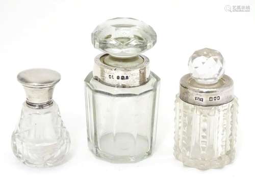 Three glass scent bottles with silver lids/collars. Hallmarked London 1898 maker William Amaziah