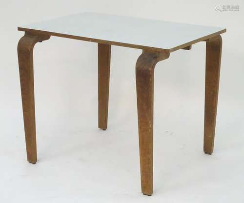 A mid 20thC table with a rectangular top above shaped tapered oak legs. 36