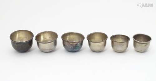 A graduated / nested set of six .900 silver small cups / sake cups. Largest approx. 1 1/2