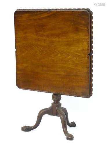 A rare mid 18thC mahogany tilt top table with an unusual moulded surround, re-entrant corners and