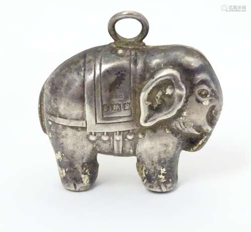 A silver rattle of pendant form, formed as an elephant, hallmarked Birmingham c. 1967, maker WHC.