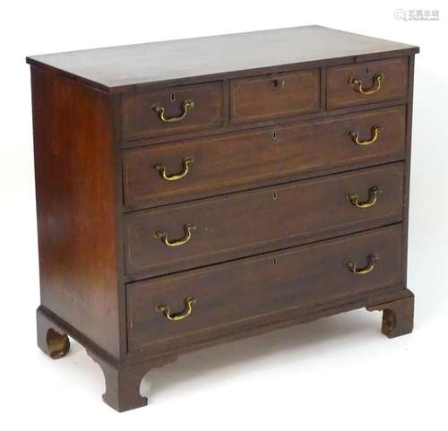 A late 18thC mahogany chest of drawers with a rectangular top above three short over three long