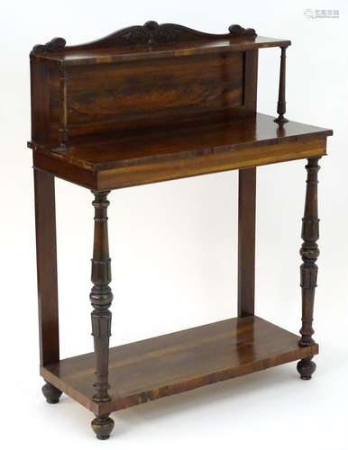 A William IV rosewood console table / pier table with a carved upstand and a raised shelf above