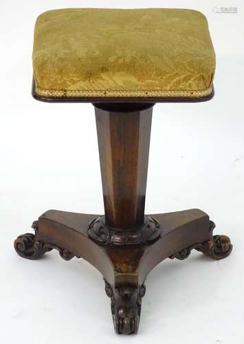 A William IV rosewood piano stool with a squared top above a triform canted pedestal base and