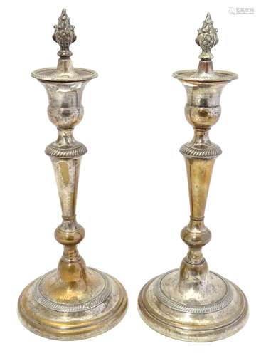 A pair of late 19thC silver plate candlesticks with flame formed tops. Approx. 13