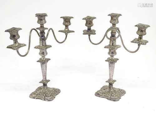 A pair of silver plate three branch table candelabra / candelabrum. Approx. 16 1/2