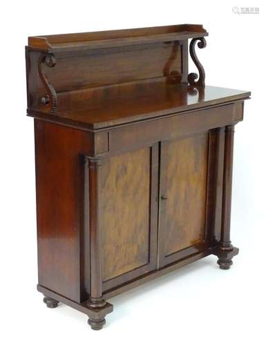 A William IV mahogany chiffonier, having a raised gallery with a shaped upstand supported by