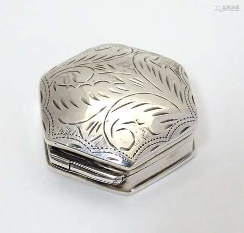 A silver pill box of hexagonal form with engraved decoration to lid. 1 1/4