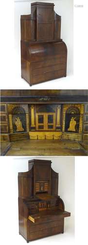 A 19thC mahogany three part bureau bookcase with a rolling cylindrical front opening to show a