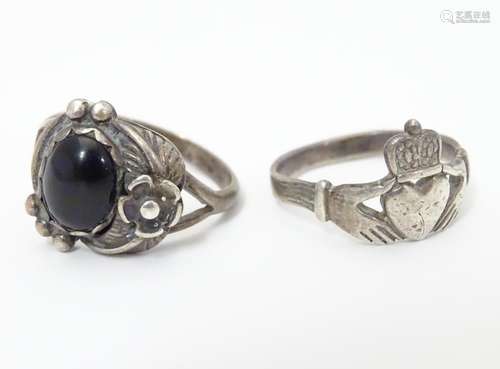 A silver ring set with onyx cabochon together with a silver Claddagh ring, each approximately size P