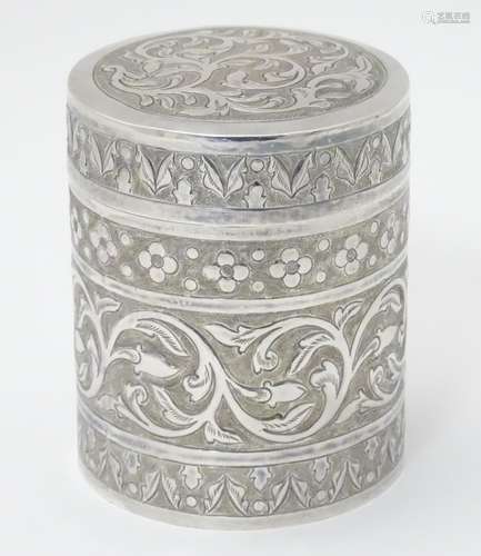 A white metal canister with floral and acanthus scroll decoration 3 1/2