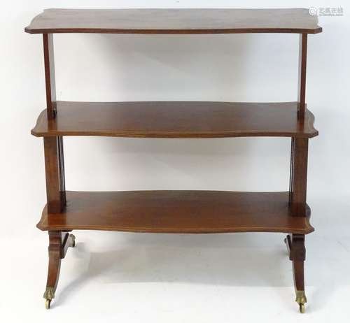 A 19thC mahogany metamorphic table/ whatnot with three shaped reeded and decoratively strung tiers