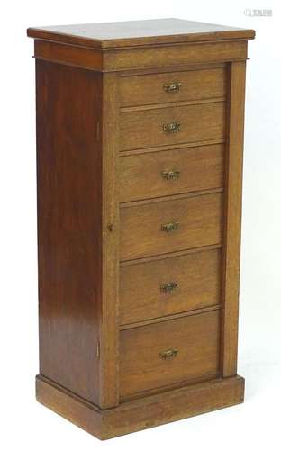 A late 19thC walnut Wellington chest with a rectangular top above six graduated drawers with brass