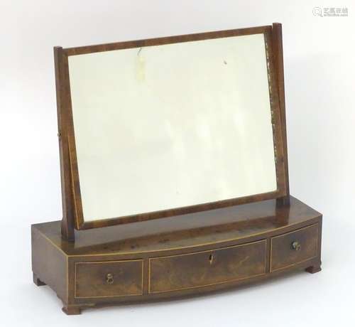 A 19thC mahogany dressing table mirror with a rectangular frame, decorative stringing and three