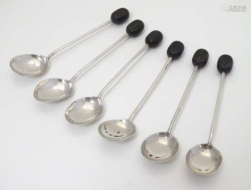 A set of 6 silver coffee spoons with coffee bean decoration to handles. Hallmarked Sheffield 1950