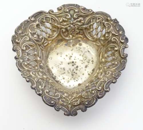 A heart-shaped silver bonbon dish with pierced decoration. Hallmarked Birmingham 1904 maker Henry