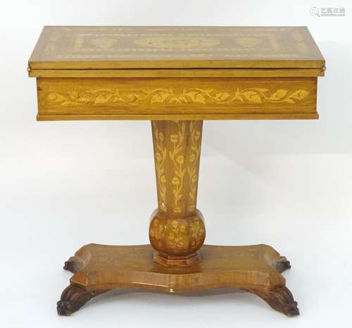 A 19thC and later Irish Killarney style games table with a marquetry inlaid and decoratively