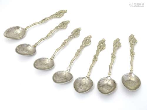 A set of 7 Japanese white metal teaspoons with dragon detail. Marked 84 Moji. Approx 5