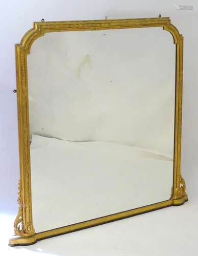 A mid / late 19thC giltwood and gesso mantle mirror with floral mouldings and bead work