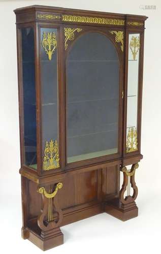 A mid 19thC mahogany vitrine / cabinet in the manner of Henry Dasson with an inverted breakfront