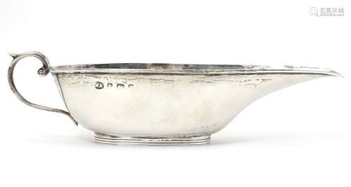 A small silver sauce boat of elongated form hallmarked Birmingham 1906 maker Aitken. 6