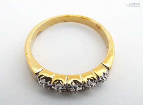 A gilt metal ring set with 5 chip set diamonds. Ring size approx. Q Please Note - we do not make