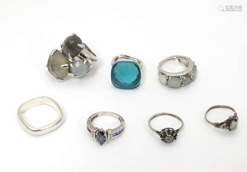 7 assorted silver and white metal dress rings. Please Note - we do not make reference to the