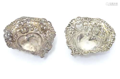 A pair of silver heart-shaped bonbon dishes with pierced decoration. Hallmarked Birmingham 1898